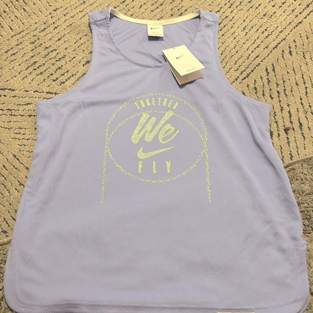 Size medium woman’s light purple jersey Nike